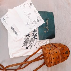 MCM Studded backpack can convert to a chic crossbody, shoulder bag, or belt bag